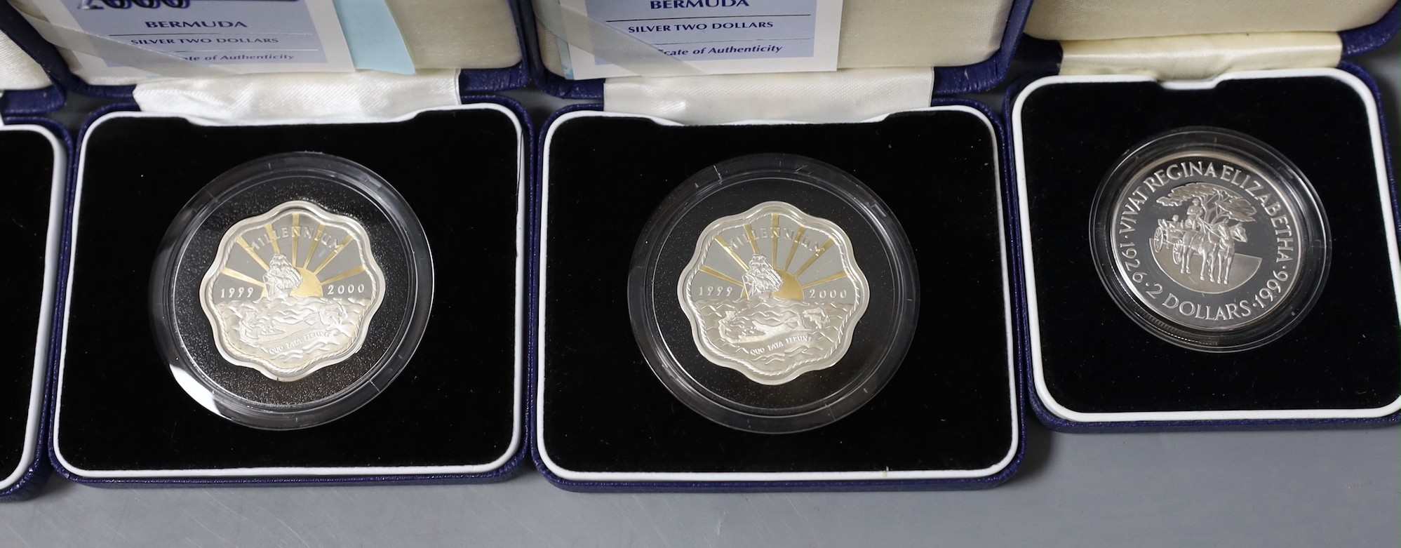 A group of boxed Bermuda silver coins